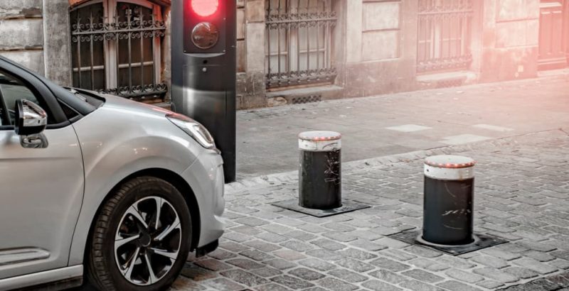 Cars next to traffic controlled bollards