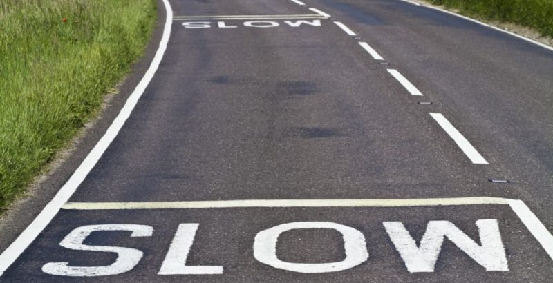 Slow markings on road