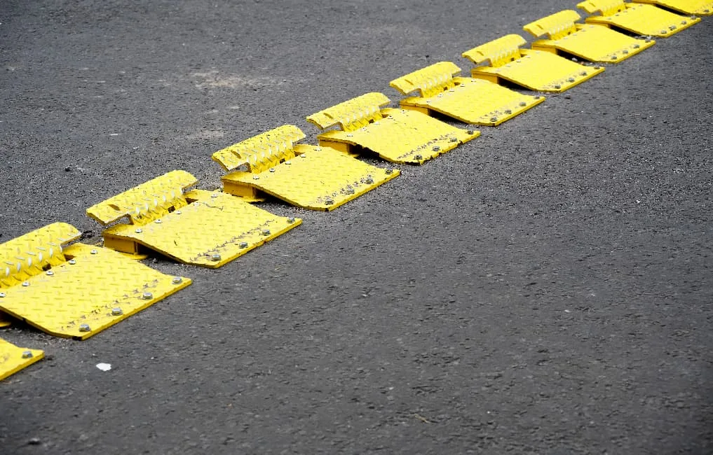 yellow traffic flow plates on road